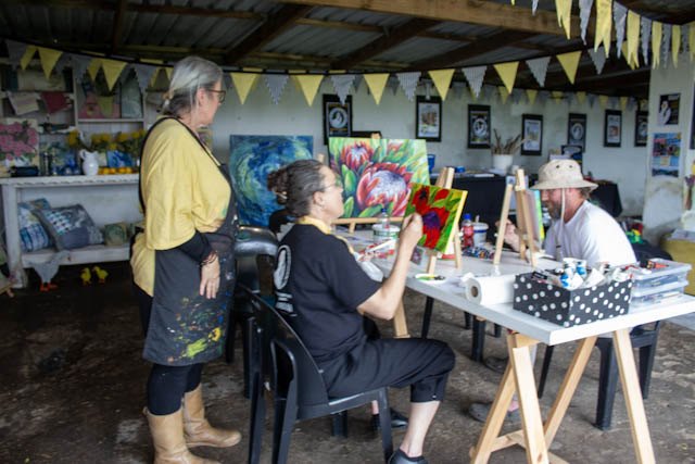 Artists painting together at the Rewilding Greater Gansbaai Festival