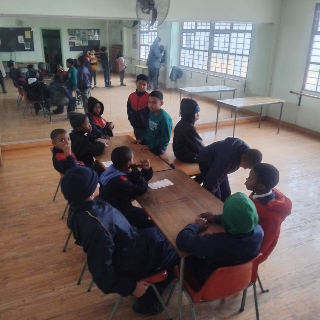 Older learners discussing a story together